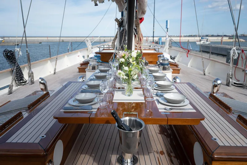Melody Yacht Photos Pics Luxurious 2022 Ridas Custom Yacht with elegant dining setup on deck.