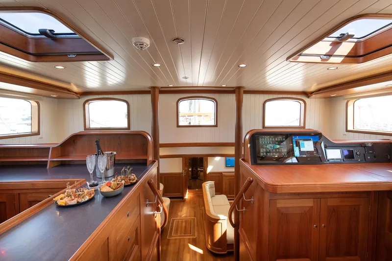 Melody Yacht Photos Pics Luxurious 2022 Ridas Custom Yacht interior with elegant wood finish and modern navigation controls.