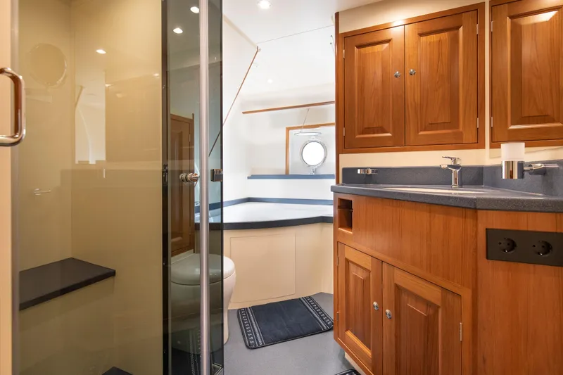 Melody Yacht Photos Pics Luxurious 2022 Ridas Custom Yacht bathroom with wooden cabinetry and modern fixtures.