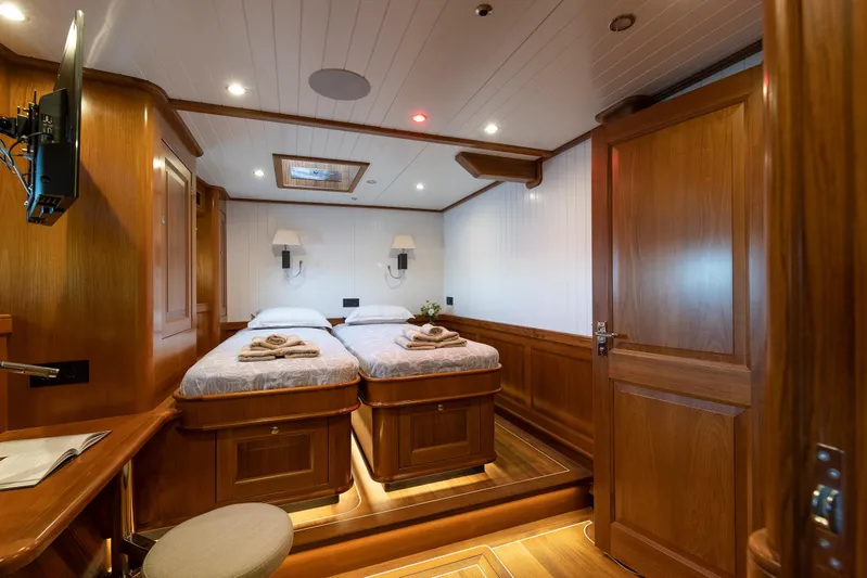 Melody Yacht Photos Pics Luxurious 2022 Ridas Custom Yacht cabin with twin beds and elegant wooden interior.