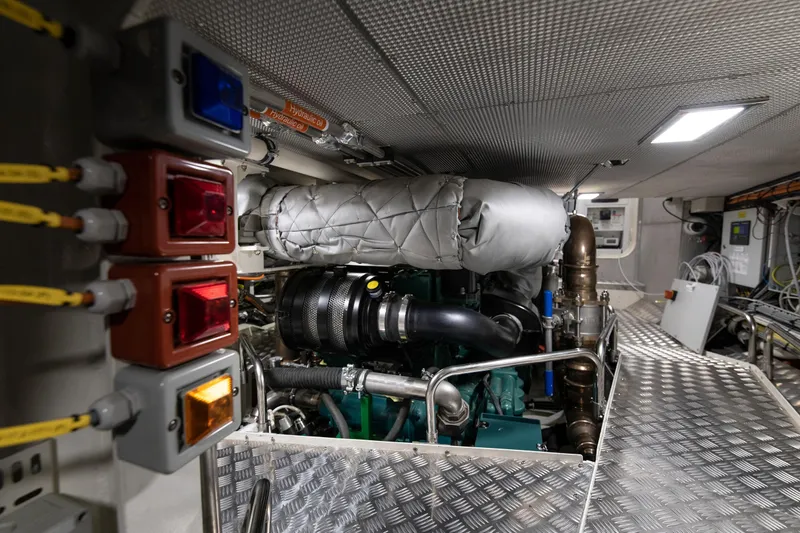 Melody Yacht Photos Pics Engine room of 2022 Ridas Custom Yacht with control panels and machinery.