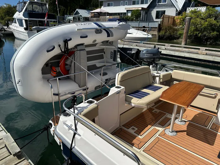  Yacht Photos Pics 2023 Ranger Tugs R-29 S with dinghy at dock.