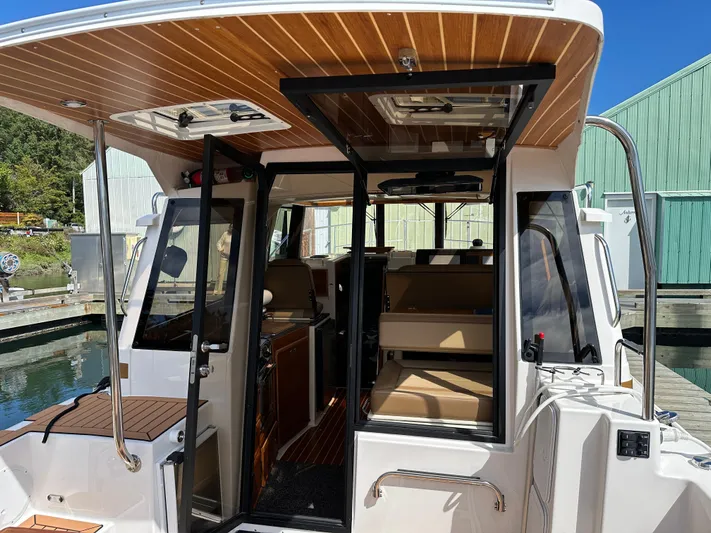  Yacht Photos Pics 2023 Ranger Tugs R-29 S with open cockpit and wood ceiling.