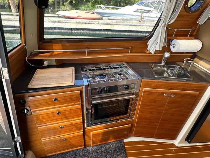  Yacht Photos Pics Interior of Ranger Tugs R-29 S yacht kitchen, 2023 model.