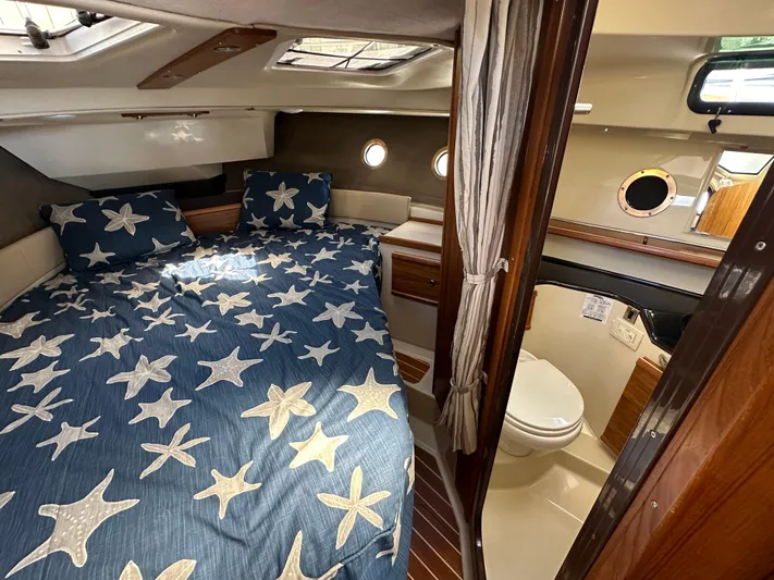  Yacht Photos Pics Interior of 2023 Ranger Tugs R-29 S with bed and bathroom.