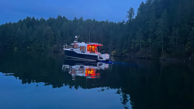  Yacht Photos Pics Ranger Tugs R-29 S 2023 on a tranquil lake at dusk.