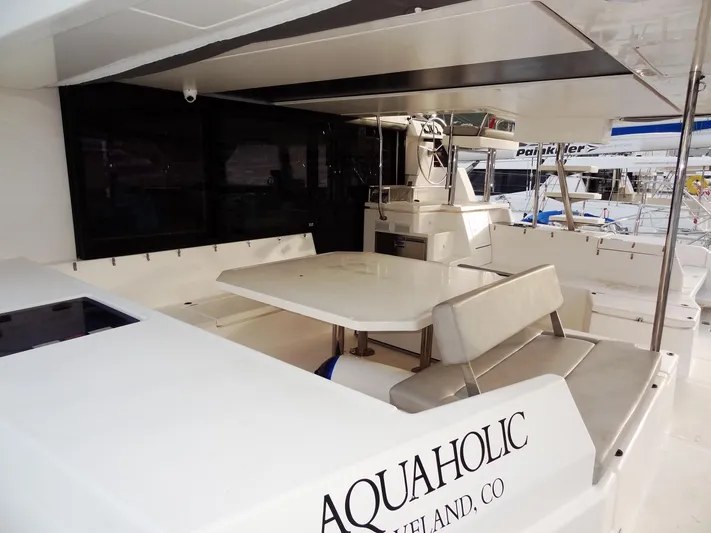 Aquaholic Yacht Photos Pics Leopard 50 yacht 2019 model with outdoor seating and table, named Aquaholic.