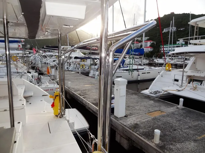 Aquaholic Yacht Photos Pics Leopard 50 yacht docked at marina, 2019 model, surrounded by other boats.