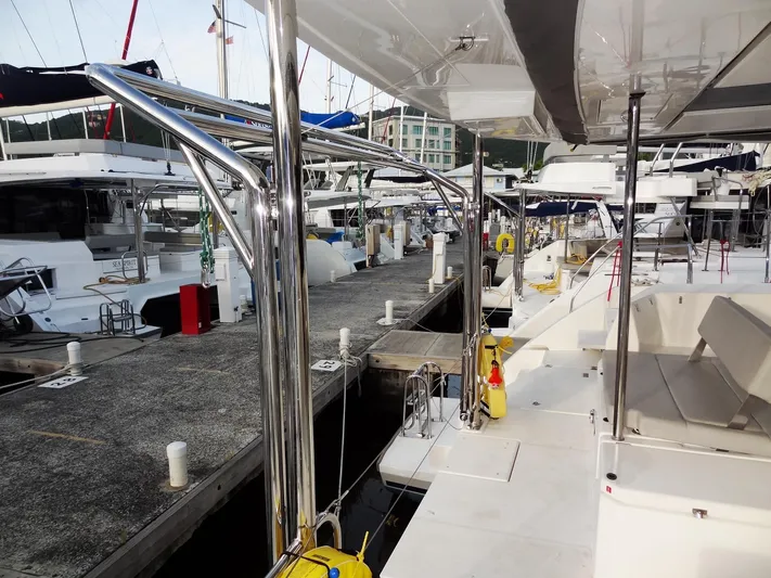 Aquaholic Yacht Photos Pics Leopard 50 catamaran docked at marina, 2019 model, sleek design, spacious deck.