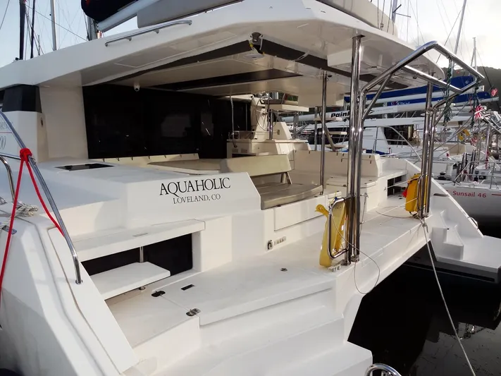 Aquaholic Yacht Photos Pics 2019 Leopard 50 catamaran named Aquaholic docked at a marina.