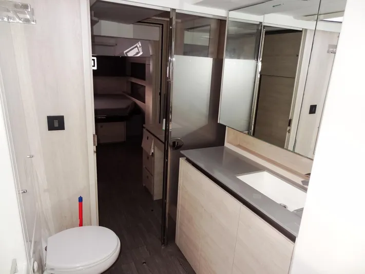Aquaholic Yacht Photos Pics Modern bathroom in a 2019 Leopard 50 yacht with sleek fixtures and ample storage.