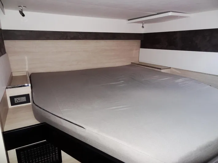 Aquaholic Yacht Photos Pics 2019 Leopard 50 yacht interior bedroom with modern design and comfortable bed.
