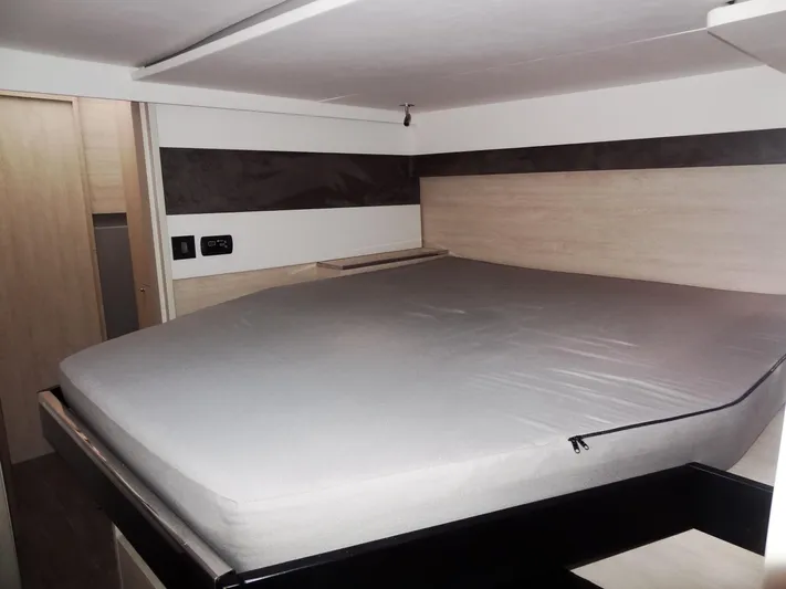 Aquaholic Yacht Photos Pics Leopard 50 2019 model interior bedroom with a large bed and modern design.