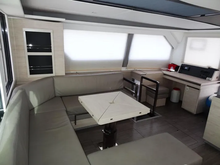 Aquaholic Yacht Photos Pics 2019 Leopard 50 yacht interior with modern seating and dining area.