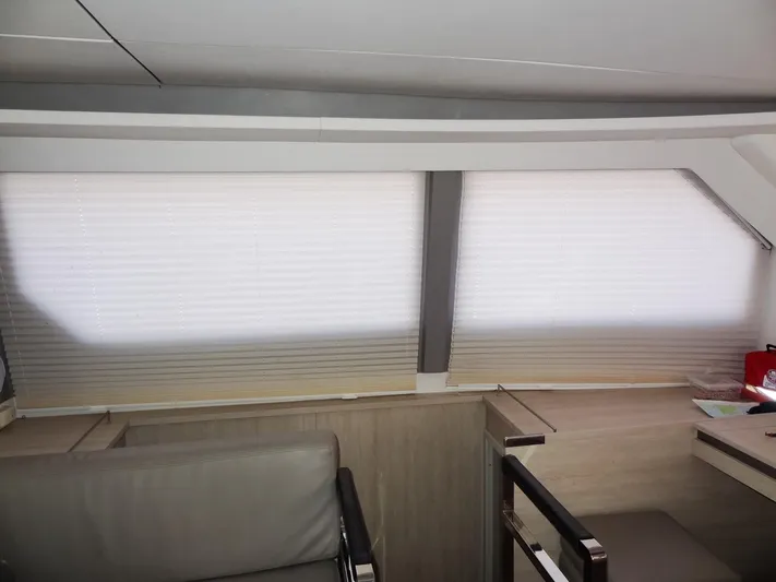 Aquaholic Yacht Photos Pics Interior of 2019 Leopard 50 yacht with modern seating and large windows.