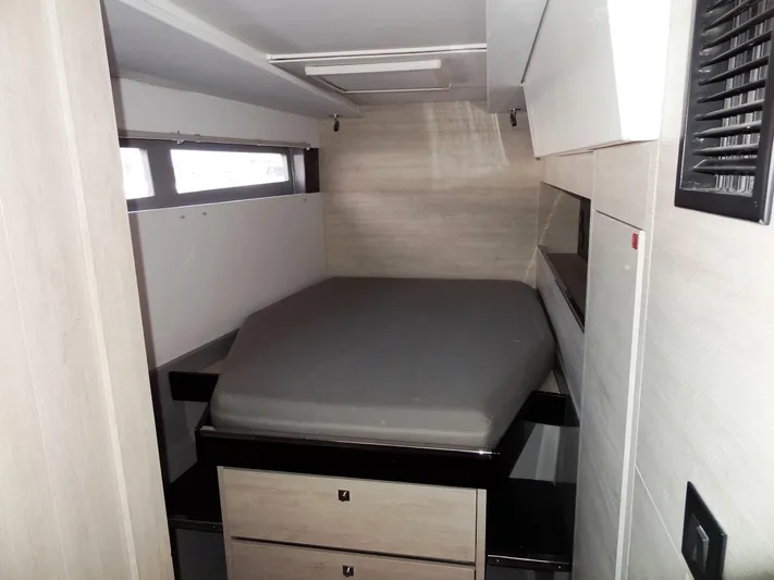 Aquaholic Yacht Photos Pics Compact bedroom in 2019 Leopard 50 yacht with modern design and storage drawers.