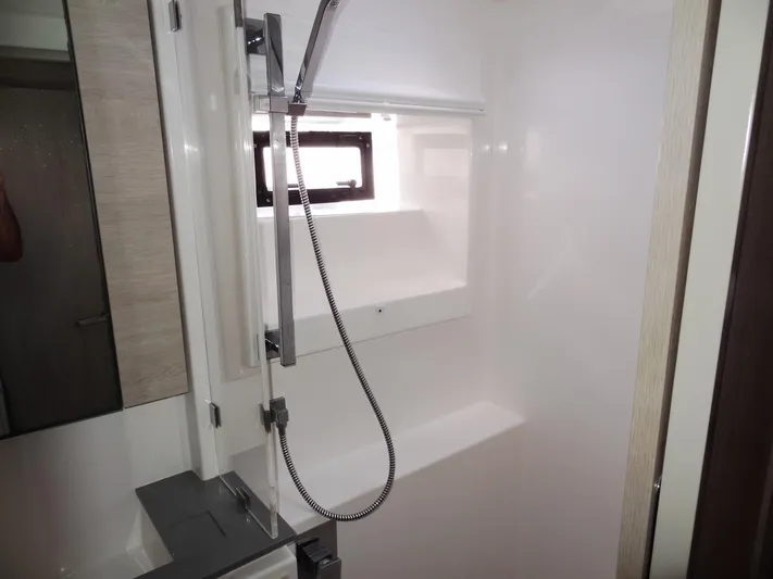 Aquaholic Yacht Photos Pics Modern shower area in 2019 Leopard 50 yacht with sleek fixtures and window.