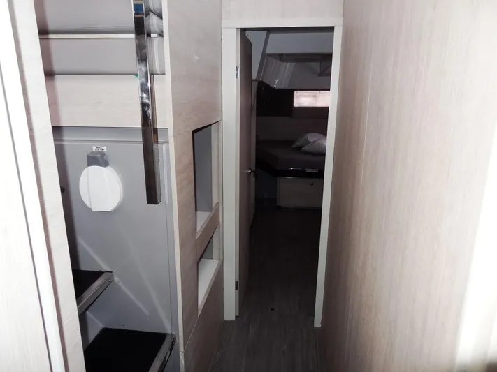 Aquaholic Yacht Photos Pics Narrow hallway in 2019 Leopard 50 yacht leading to bedroom.