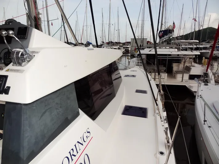 Aquaholic Yacht Photos Pics 2019 Leopard 50 yacht docked in a marina, side view.