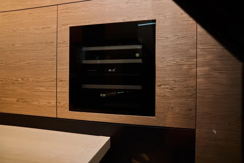  Yacht Photos Pics Built-in appliance in luxurious wood-paneled interior of 2023 Ferretti Yachts 920.