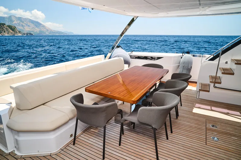  Yacht Photos Pics Luxurious 2023 Ferretti Yachts 920 deck with elegant seating and ocean view.