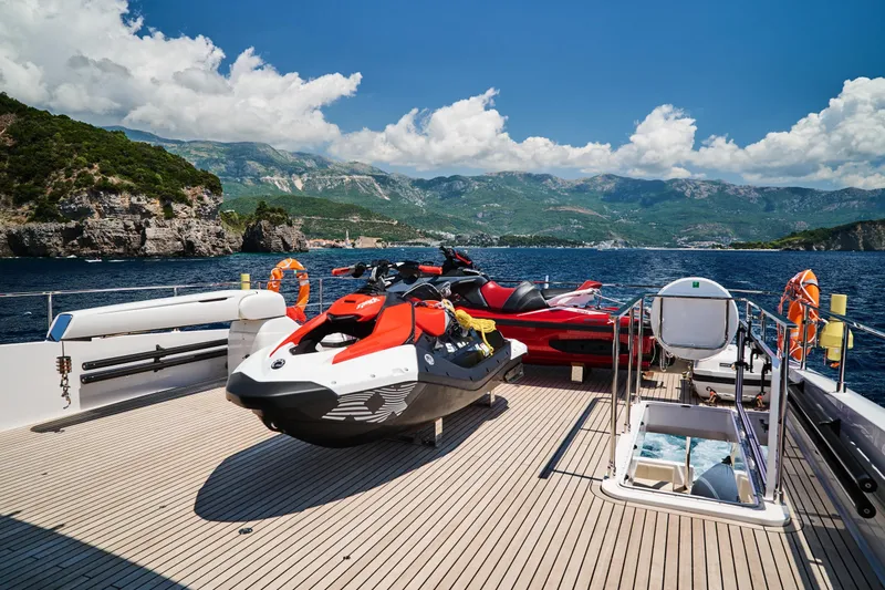  Yacht Photos Pics Luxury Ferretti Yachts 920 deck with jet skis, scenic coastal view, 2023 model.