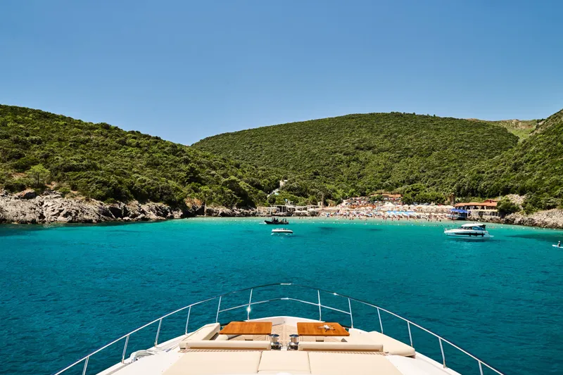  Yacht Photos Pics Ferretti Yachts 920 cruising towards a scenic beach, 2023 model.