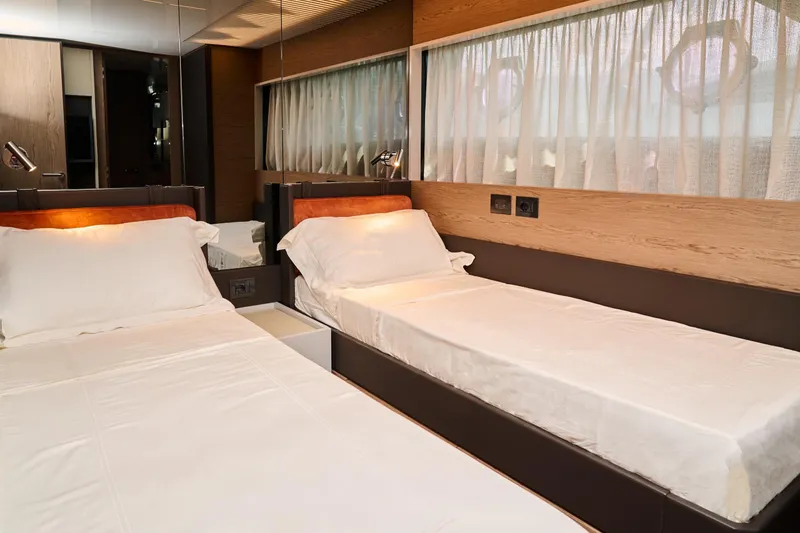  Yacht Photos Pics Luxurious twin bedroom in 2023 Ferretti Yachts 920, featuring modern design and elegant decor.