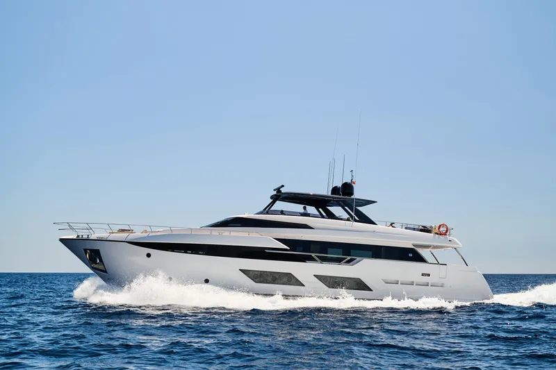  Yacht Photos Pics 2023 Ferretti Yachts 920 cruising on open sea under clear blue sky.