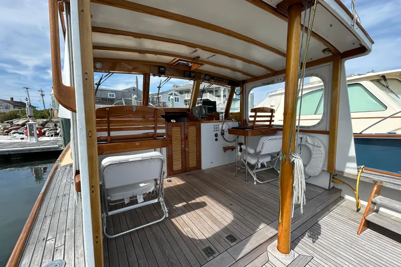 Bugle Boy Yacht Photos Pics Interior view of a 1994 John Williams Stanley 36 boat with wooden accents and seating.