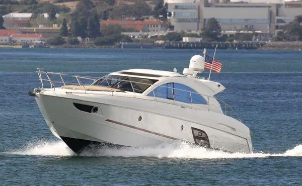 Be Water My Friend Yacht Photos Pics 2016 Beneteau GT49 yacht cruising on open water with American flag.