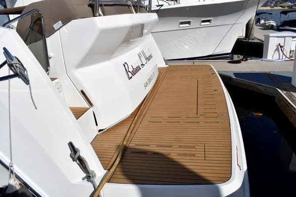 Be Water My Friend Yacht Photos Pics 2016 Beneteau GT49 yacht with teak deck at marina.