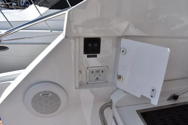Be Water My Friend Yacht Photos Pics 2016 Beneteau GT49 yacht control panel with Bose speaker and open compartment.