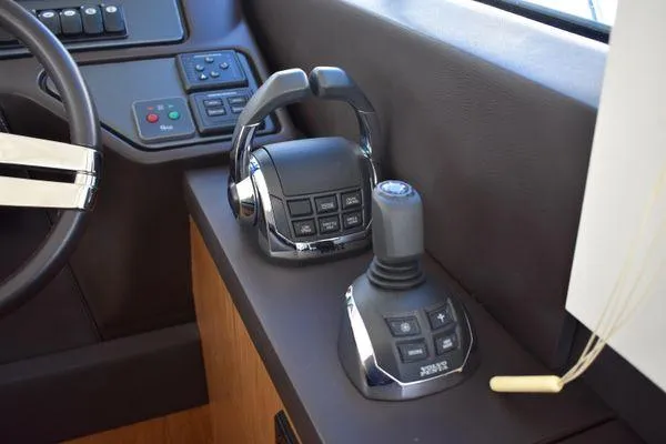 Be Water My Friend Yacht Photos Pics 2016 Beneteau GT49 yacht helm controls with joystick and throttle.