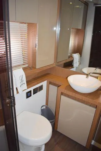 Be Water My Friend Yacht Photos Pics 2016 Beneteau GT49 yacht bathroom with modern fixtures and wood accents.