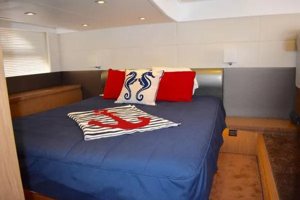 Be Water My Friend Yacht Photos Pics Luxurious bedroom in 2016 Beneteau GT49 yacht with nautical-themed decor.