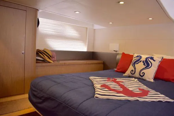 Be Water My Friend Yacht Photos Pics Luxurious cabin interior of 2016 Beneteau GT49 yacht with nautical-themed decor.