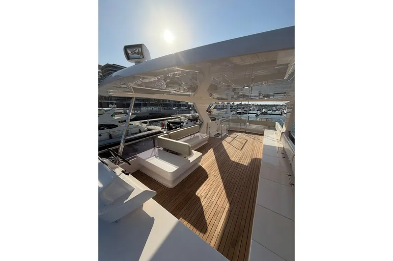 Yacht Photos Pics Luxurious 2025 Haiquan 62 yacht deck with modern seating and sunlit views.