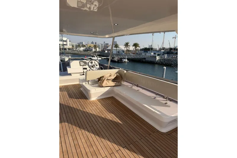  Yacht Photos Pics Luxurious 2025 Haiquan 62 yacht deck with seating, overlooking marina.
