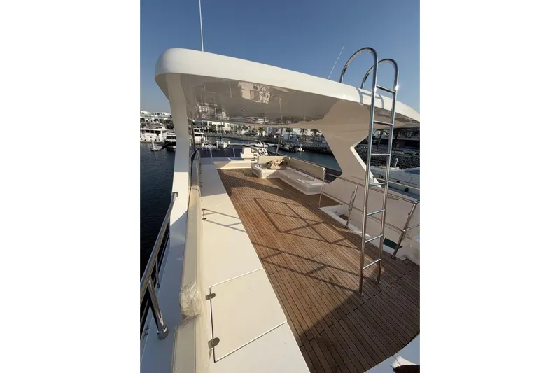  Yacht Photos Pics Luxurious 2025 Haiquan 62 yacht deck with wooden flooring and sleek design.