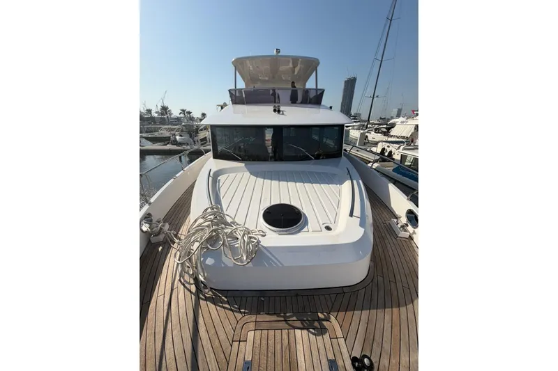  Yacht Photos Pics 2025 Haiquan 62 yacht docked at marina, showcasing sleek design and spacious deck.