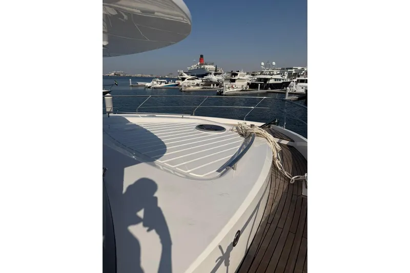  Yacht Photos Pics Luxury Haiquan 62 yacht docked at marina, 2025 model, with clear blue sky.