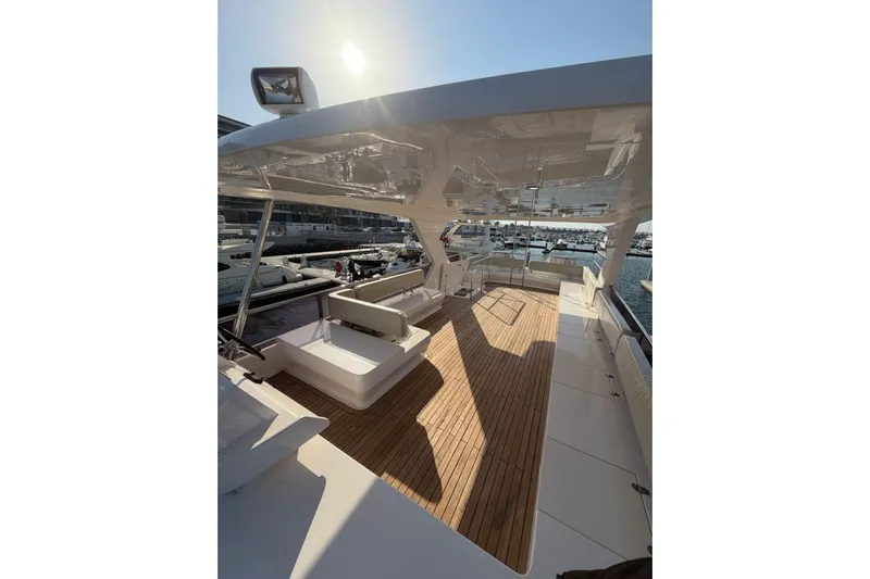  Yacht Photos Pics Luxurious 2025 Haiquan 62 yacht deck with wooden flooring and modern seating.