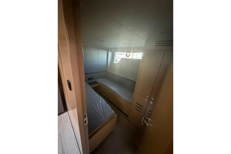  Yacht Photos Pics Interior cabin of 2025 Haiquan 62 yacht with twin beds and storage.