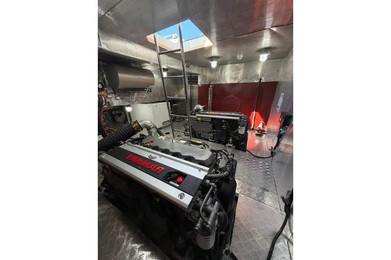  Yacht Photos Pics Engine room of 2025 Haiquan 62 yacht with Yanmar engines and metallic interior.