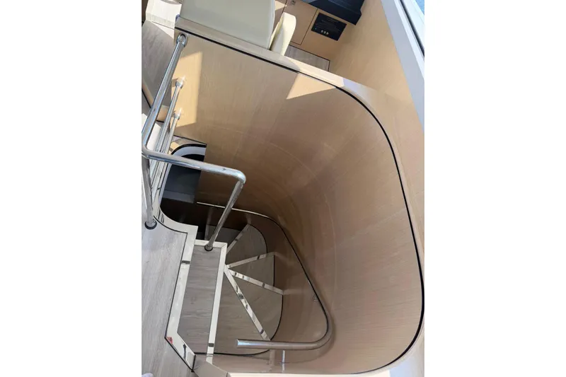  Yacht Photos Pics Modern spiral staircase on 2025 Haiquan 62 yacht, featuring sleek design and metal railings.