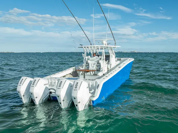  Yacht Photos Pics Freeman 37 boat, 2021 model, with quad engines on open water under a clear sky.