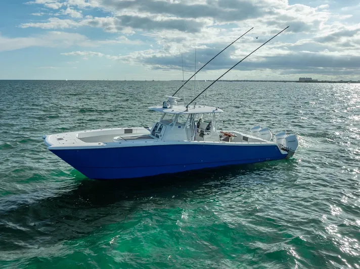  Yacht Photos Pics Freeman 37 boat, 2021 model, cruising on open water under a partly cloudy sky.