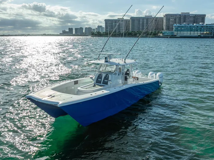  Yacht Photos Pics Freeman 37 boat, 2021 model, on water with city skyline in background.