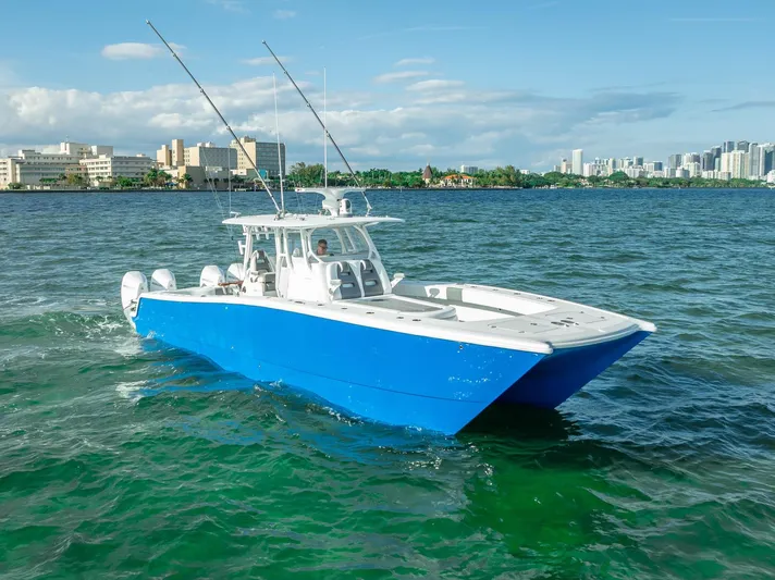  Yacht Photos Pics 2021 Freeman 37 boat cruising on a sunny day in coastal waters.